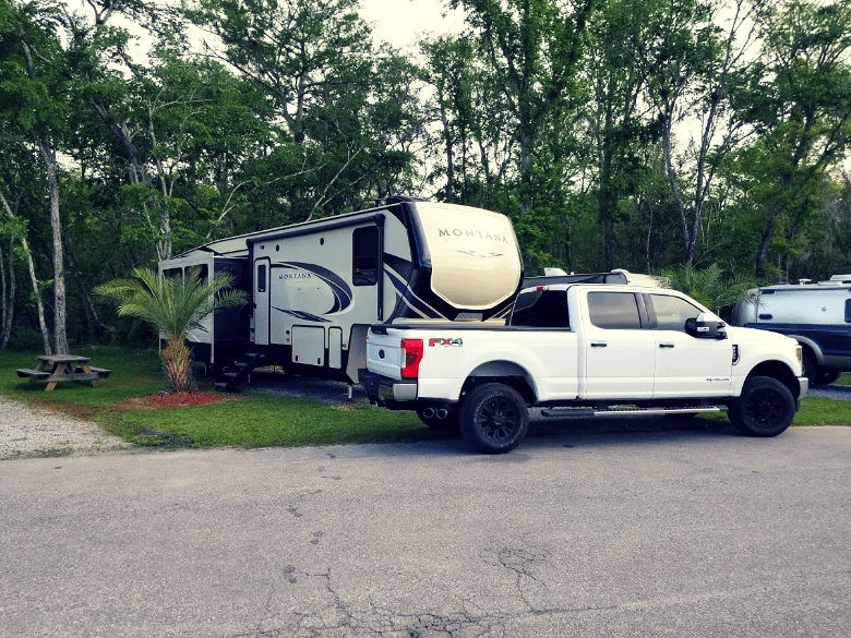 Truck and 5th wheel parked at Deland KOA